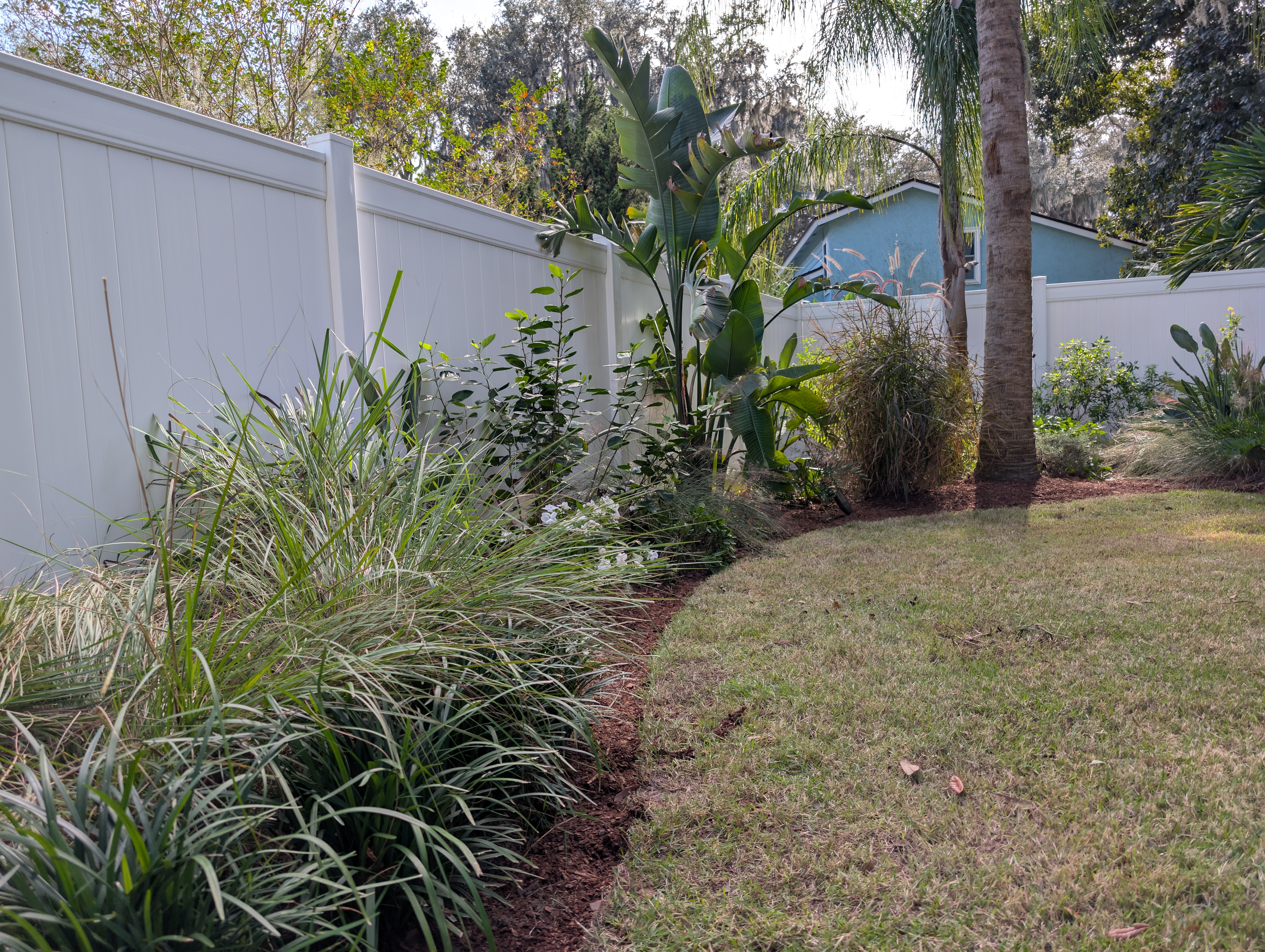 Curved walkway with flower beds